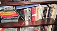 All books on top shelf of bookcase pictured