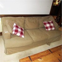 Tan sofa with pillows