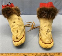 Lot of children's seal skin mukluks with beaver in