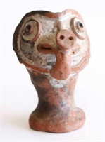 Terracotta figural vase with face detail