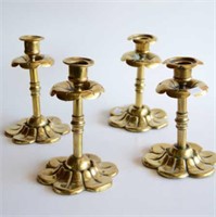 Two pairs of Arts & Crafts brass candlesticks