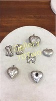 Selection of .925 hearts and bow pendants with