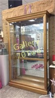 Large gilded lighted display cabinet with glass