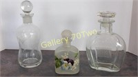 Pair of etched glass decanters with coordinating