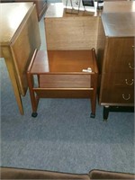 MID CENTURY OCCASIONAL TABLE WITH MAGAZINE RACK