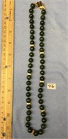Jade bead and gold tone bead necklace with 14Kt go