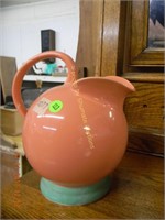 Pink pitcher with green base