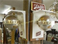 Pair of Schlitz spinning and lighted bar signs