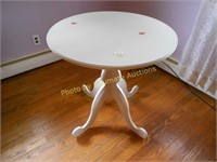 White pedestal table with glass top