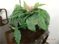 Basket of artificial fern and roses