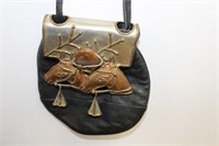 LEATHER PURSE WITH METAL ACCENT
