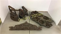Selection of cast iron items – include sad irons,
