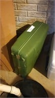 Green hard side luggage
