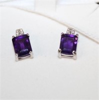 Emerald cut 3.15 ctw Amethyst gems are accented