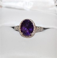 Large 3 carat Amethyst gemstone is surrounded by