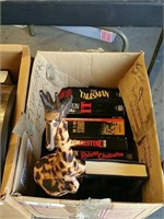 Box of books and giraffe