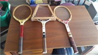 Three wooden tennis racks