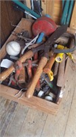 Various hand tools and hardware in bins