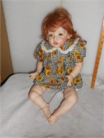 Baby Doll with red hair and sunflower romper