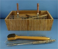 Wood box full of tools, barbecue accessories, etc