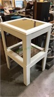 Pair of white side tables with wicker inserts and