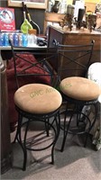 Pair of iron swivel barstools with the cushion