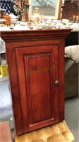 Hanging one door cabinet with two shelves behind,