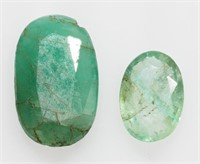 Unset gemstones: two oval cut emeralds