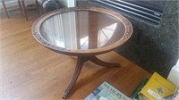 Round glass topped pedestal coffee table