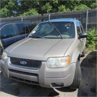 7 2001	FORD	ESCAPE	GRAY 1FMYU04101KA34483