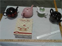 4 teapots and a Victorian Rose tea set in the box