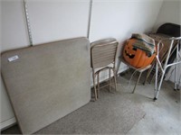 Card table, chairs, lighted jack o lantern