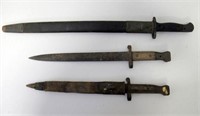 Three various bayonets two with scabbards