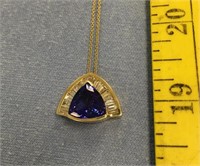14K yellow gold tanzanite and diamond pendant with
