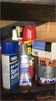 Contents of wall cabinet includes tools, aerosols