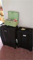 Two roller suit cases and sewing box
