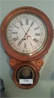 Large faced wall hanging clock