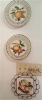 Decorated plates in wall hangers fruit design