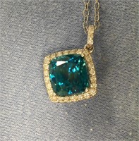 14K white gold blue zircon and diamond pendant wit
