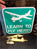 LEARN TO FLY HERE TIN SIGN AND CAST METAL VINTAGE