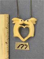 1 1/2" x 2" carved ivory pendent of two rabbits to