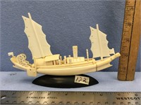 Highly carved 7 1/2" bone sailing vessel mounted o