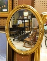 Gilt Oval Floral Accented Mirror.