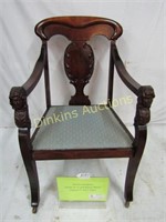 Carved Mahogany Chair with Faces