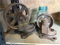 two heavy cast iron large casters