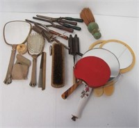 Vintage vanity items including mirrors, brushes,