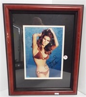 Framed and double matted Raquel Welsh autographed