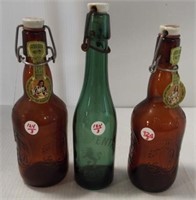 (3) Ceramic top glass bottles. Measures 9.5"