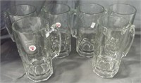 (6) Large clear glass beer mugs. Measure 8" tall.