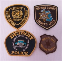 (4) Police patches including Macomb County